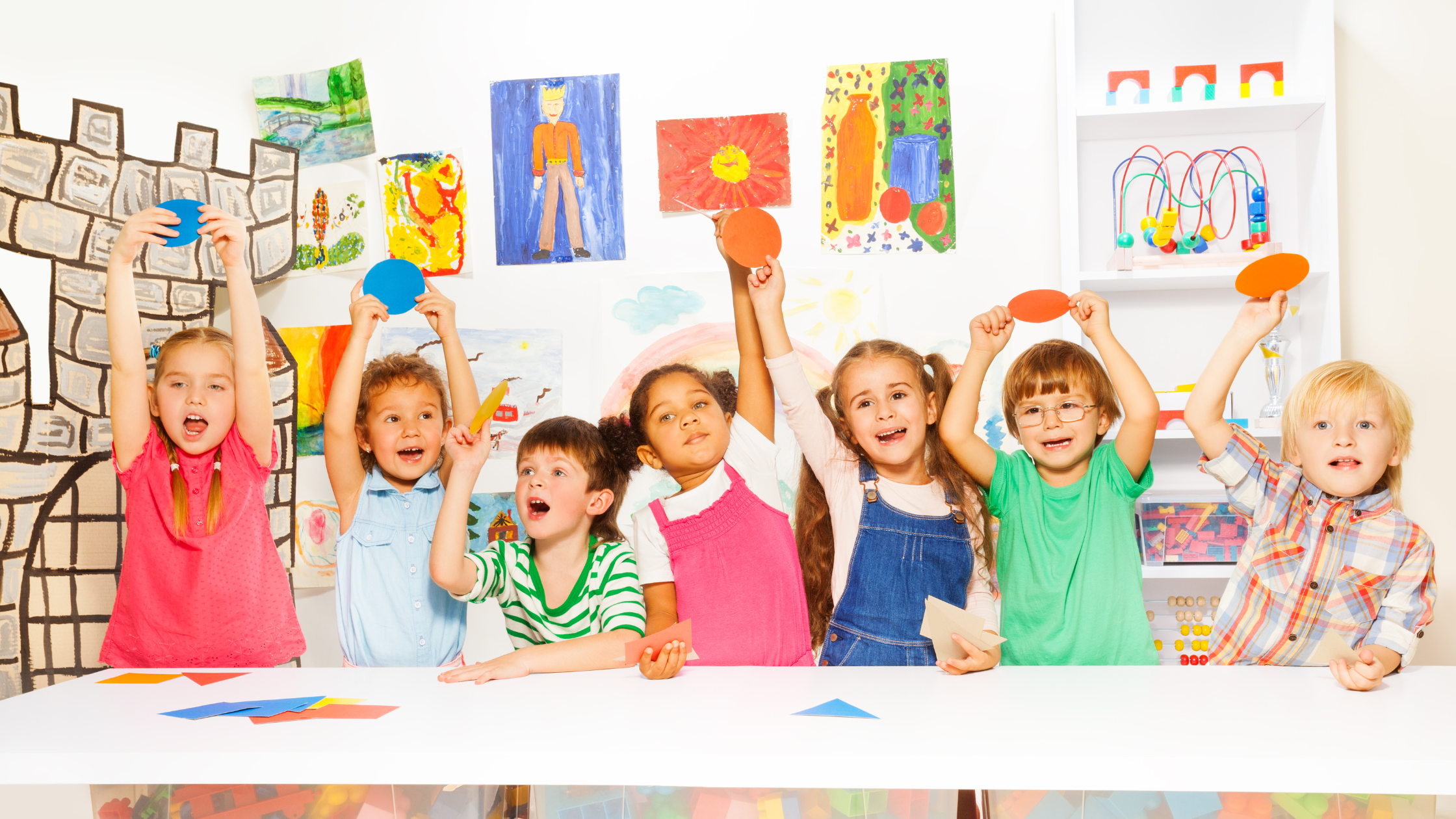 Kids raising their hand, holding their circles