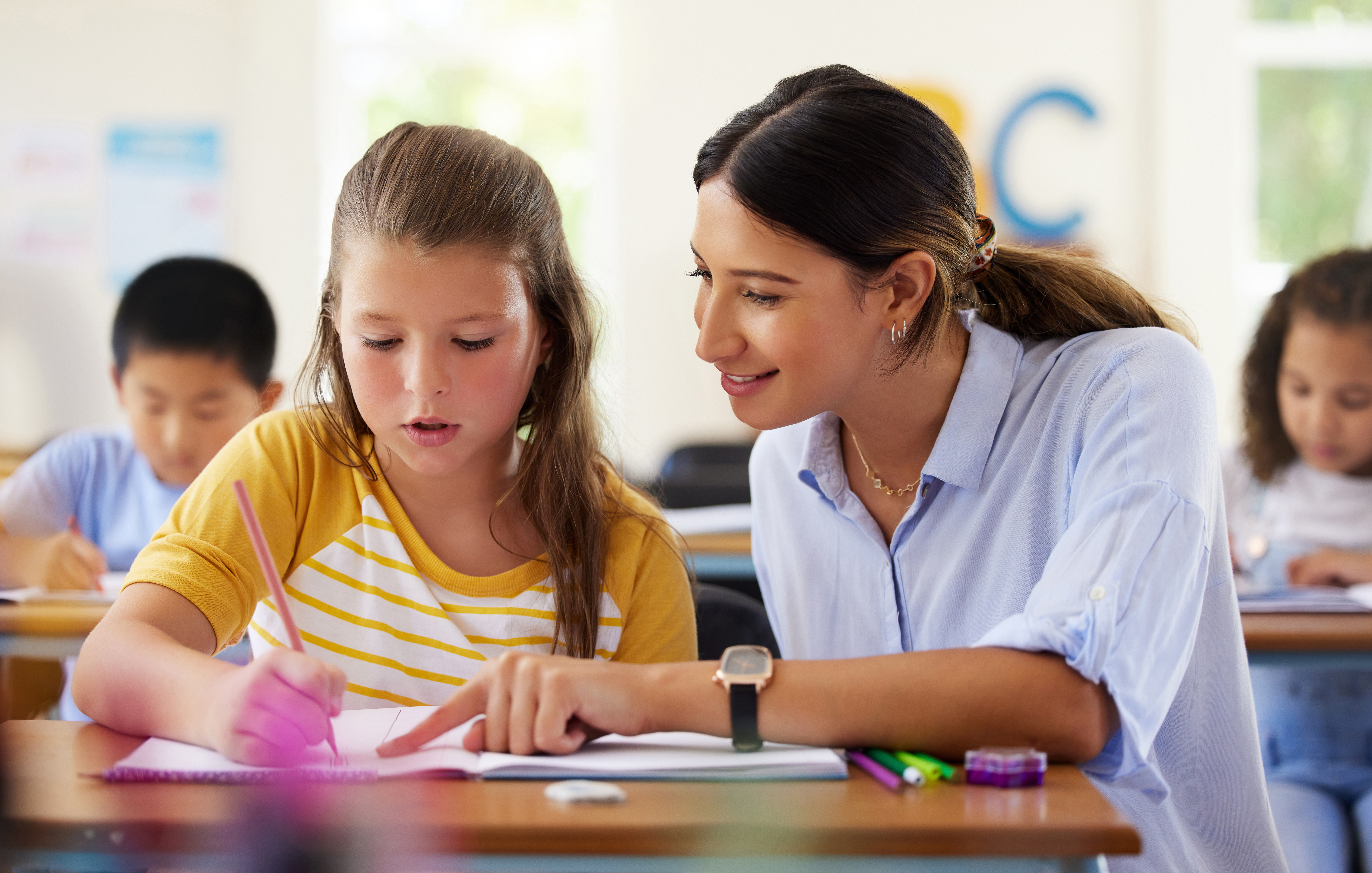 a teacher teaching a student